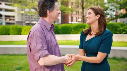 A lawyer and a client shaking hands.