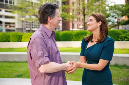 A lawyer and a client shaking hands.