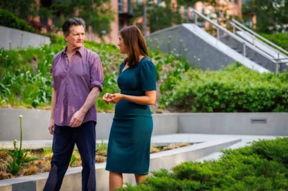 A lawyer and client having a conversation outside.